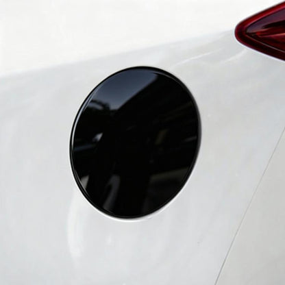 Black circular fuel tank cap sticker for Mazda, close-up on car body