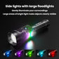 Black flashlight with bright front beam and colorful side lights around the head