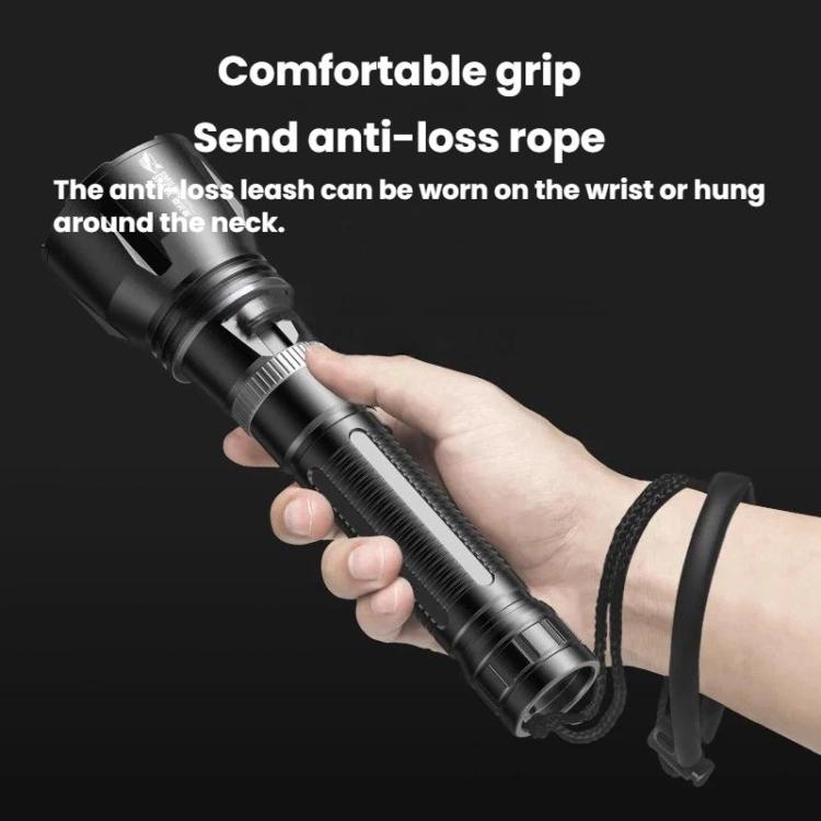 Diving flashlight in hand with anti-loss lanyard and textured cylindrical grip
