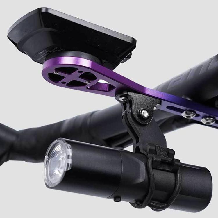 Purple extension base and black clamp holding a bike headlight on handlebars