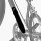 Black silicone bike frame protector pad installed on silver frame tube