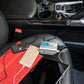 Aluminum car power inverter with cables on car seat, ready to power devices.