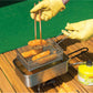 COOL CAMP stainless steel foldable strainer basket in use for frying on a grill