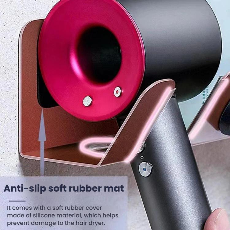 Rose gold circular dock and black rubber anti-slip mat on wall mount hair dryer holder.
