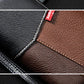 Close-up of two-tone wallet seams with RFID logo patch and contrast edge stitching.