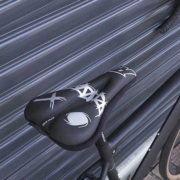 Black bike saddle cover with white graphics installed on a bicycle saddle