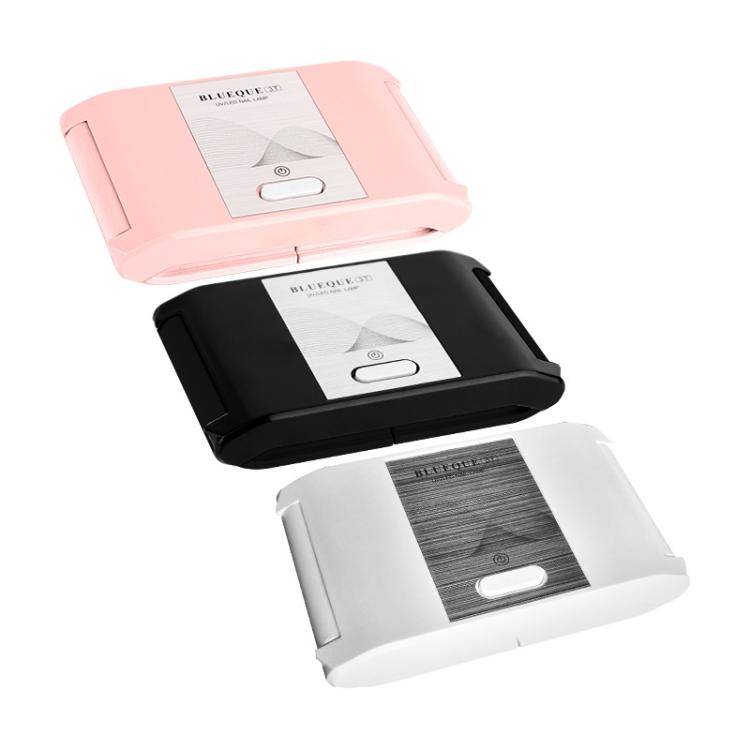 Folding LED nail curing lamp set in pink, black, and white with power button