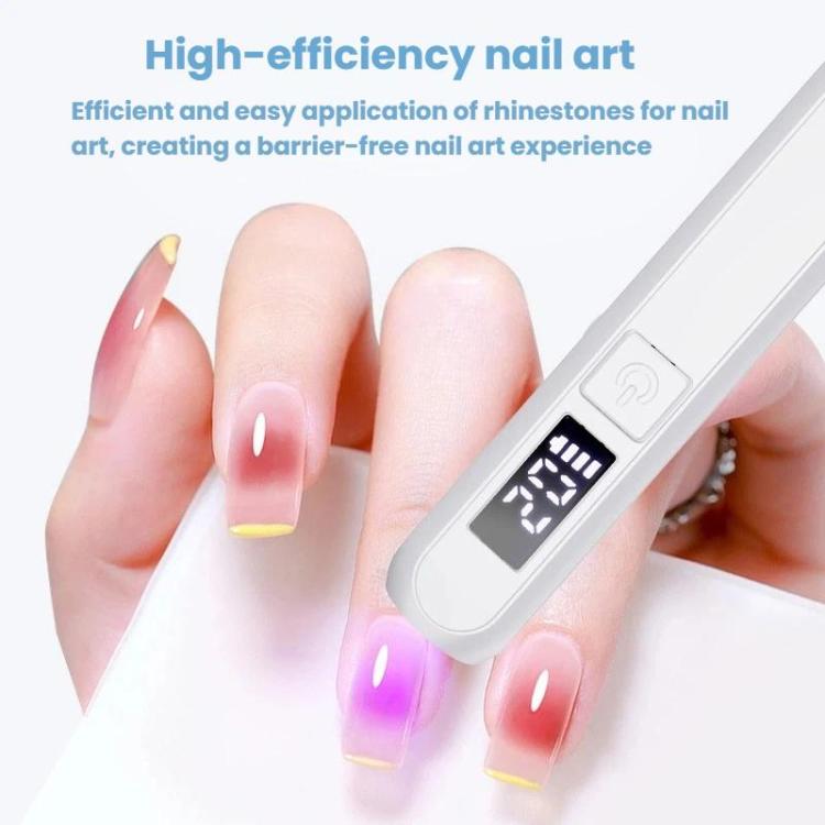 Handheld white LED nail drying lamp with screen, shown curing a single nail tip