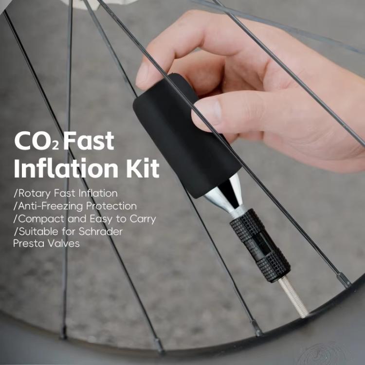 CO2 inflator valve head with foam anti-freeze sleeve attached to a tire wheel
