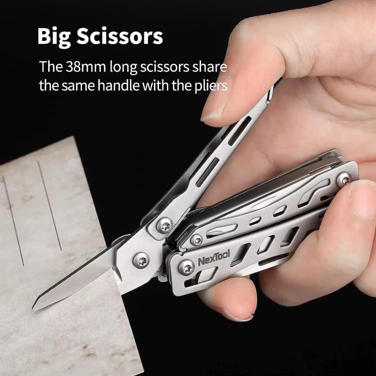 Silver multitool pliers with large scissor blades, held in hand