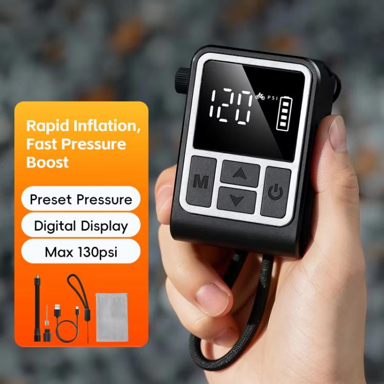 Hand holding black digital air pump inflator with preset-style display and control panel