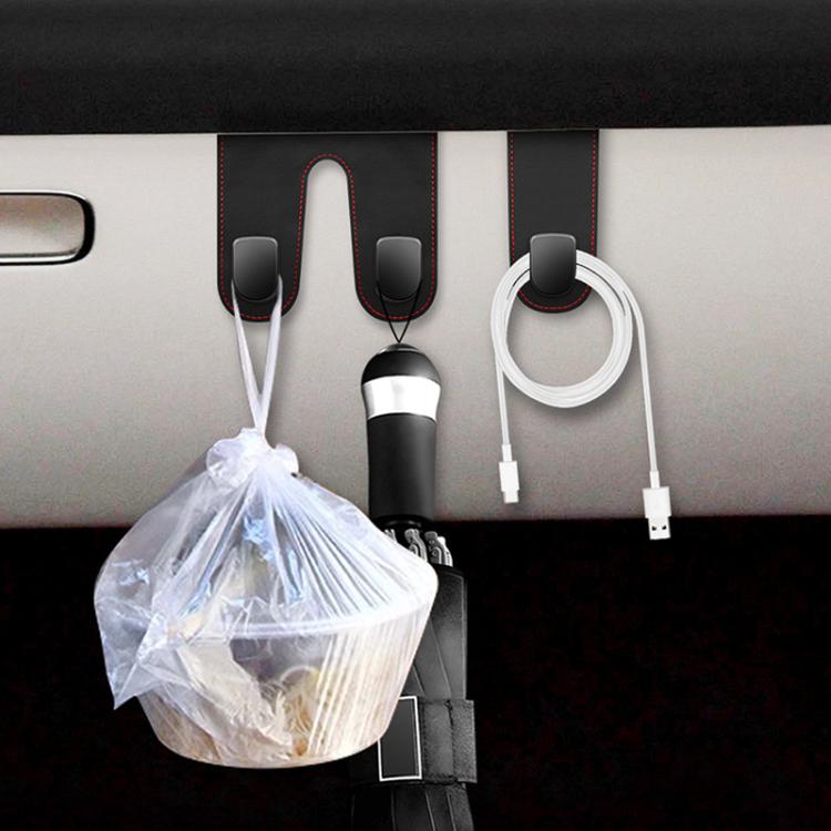 Car interior multi-hook set holding bottle, cable, and trash bag, black and white