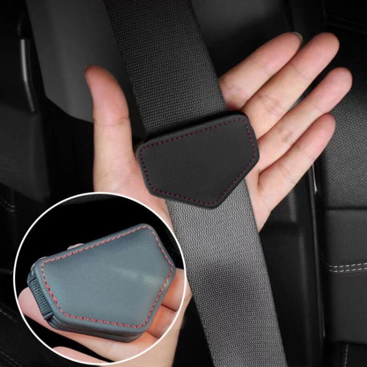 Seat belt tension limiter pad on belt, black with red stitched border