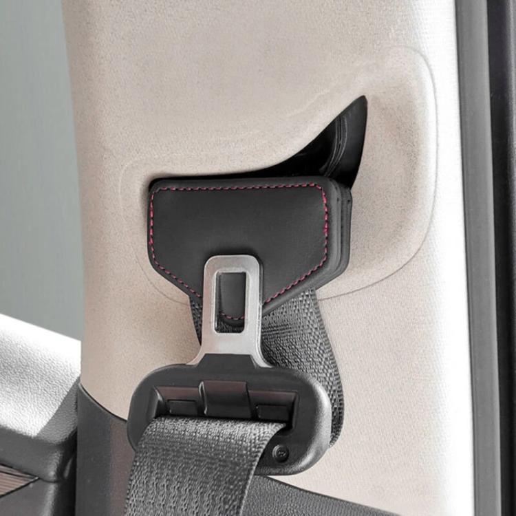 Car seat belt tension limiter clip with black pad, red stitched border