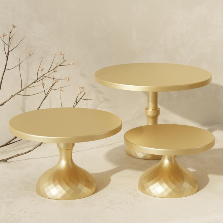 Gold tiered cake stand set with three round plates on pedestal bases for desserts