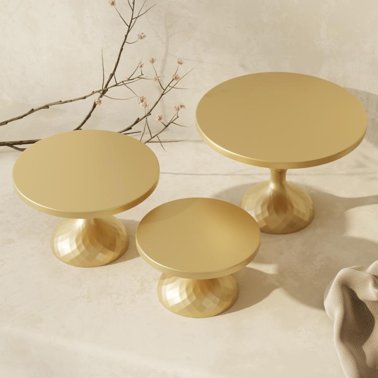 Gold three-tier cake stand set with round plates and flared pedestal bases