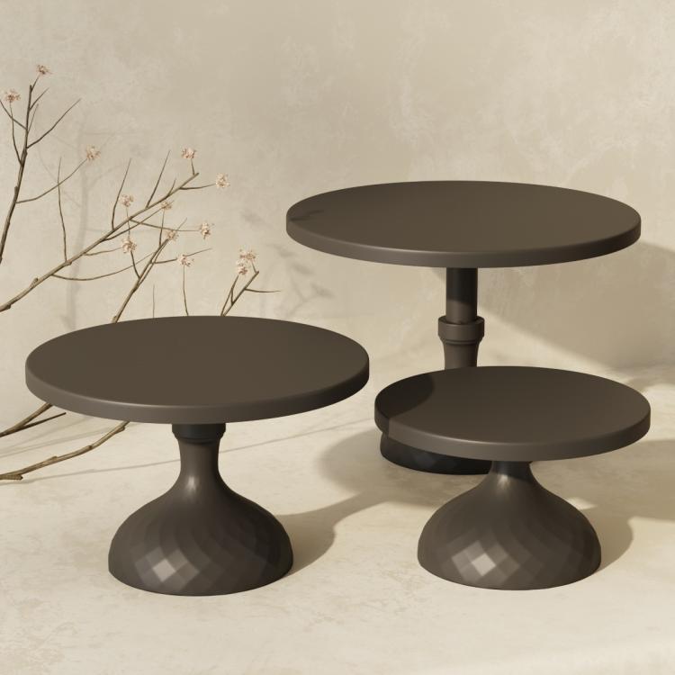 Black tiered cake stand set with three round plates on pedestal bases