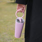 Pink vacuum insulated sports cup with carry handle, sealed lid and drinking straw