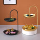 Black and gold two-tier wrought iron serving trays with arched handles