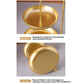 Gold two-tier tray close-up with arched stand and shallow plates