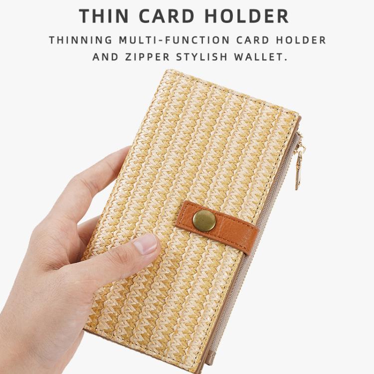 Beige straw-weave long wallet held in hand, side zipper with brown snap tab