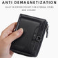 Hand holding black compact leather wallet with front card pocket and zipper