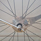 BIKERSAY freewheel removal tool on rear wheel, turning a cassette lockring with 11T/12T head
