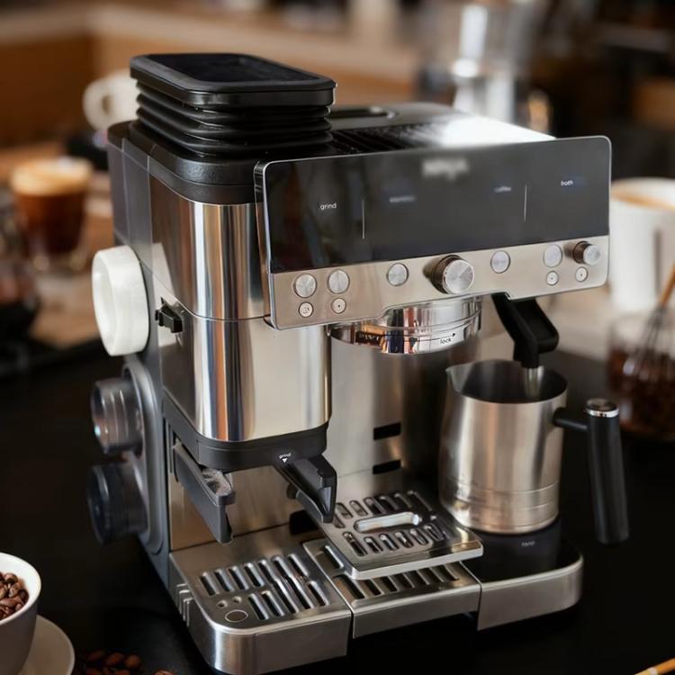 Bean hopper extension installed on a stainless espresso machine with black ridged top