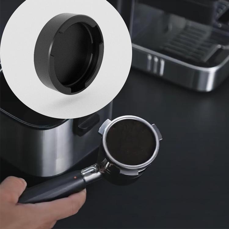 Close-up of black handle storage rack opening holding a portafilter
