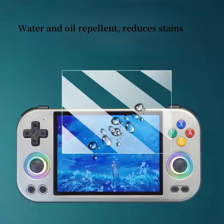 Clear tempered glass screen protector on handheld screen with water droplets