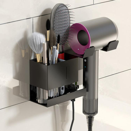 Black wall-mount hair dryer holder with divided brush slot and cord organizer.