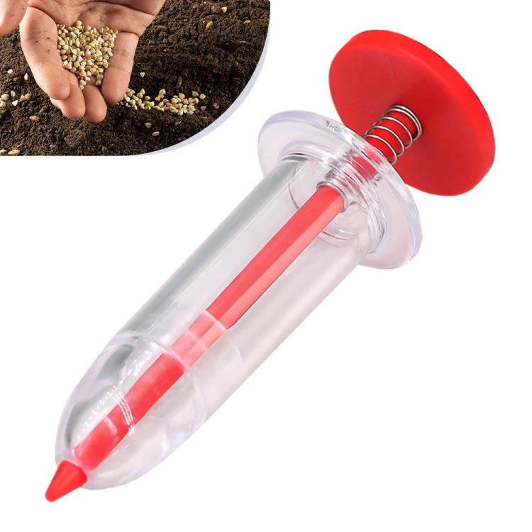 Clear syringe-type seed planter with red plunger and red planting tip