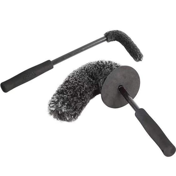 Wheel hub cleaning brush with long black handle, gray scrub pad, and cylindrical bristle head