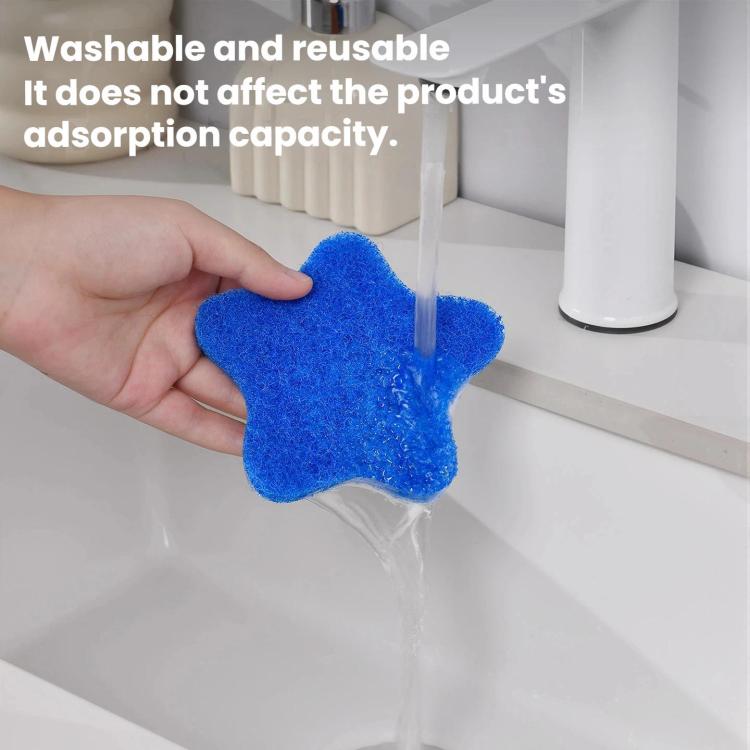 Blue felt star lint remover pad held under running water