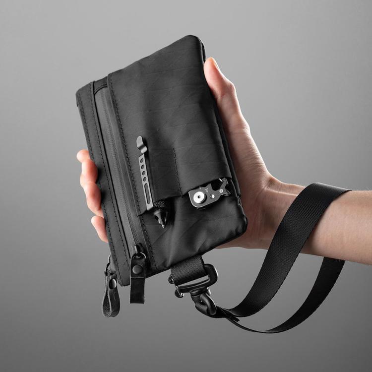 Black RFID-blocking card wallet with zipper and keychain attachment, front view