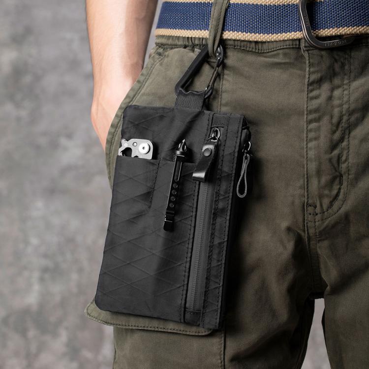 Green RFID-blocking card wallet worn on belt loop, zip pocket and keychain visible