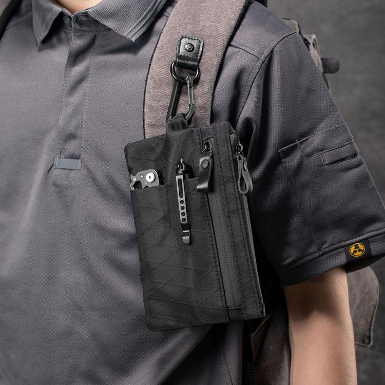 Black RFID-blocking card wallet worn on chest strap, zip pocket and zipper pulls visible