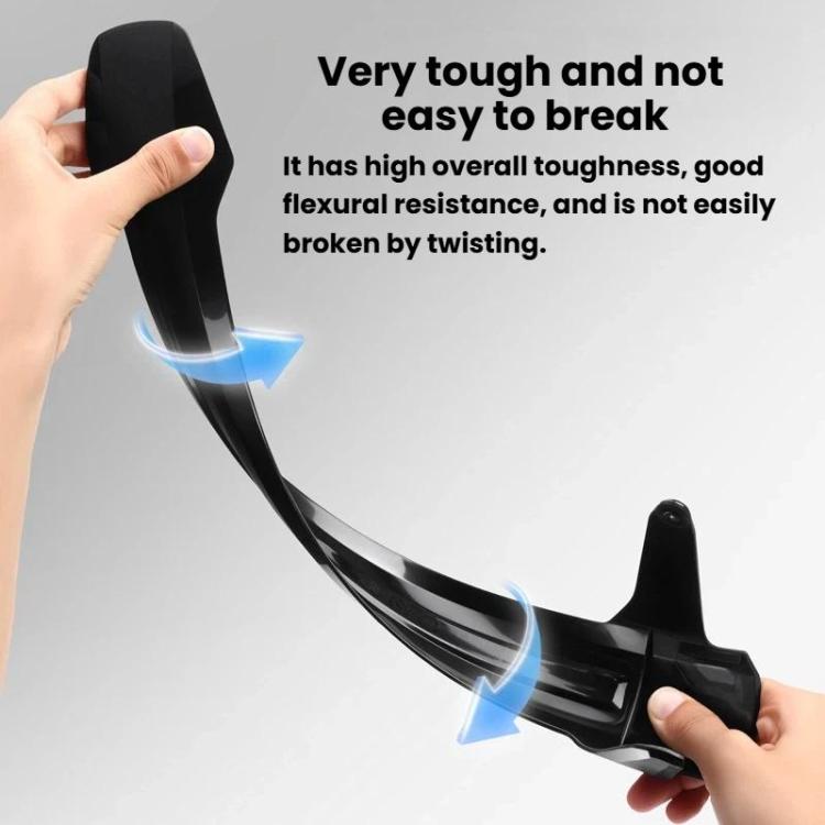 Flexible black bike fender held by hand, showing bend resistance