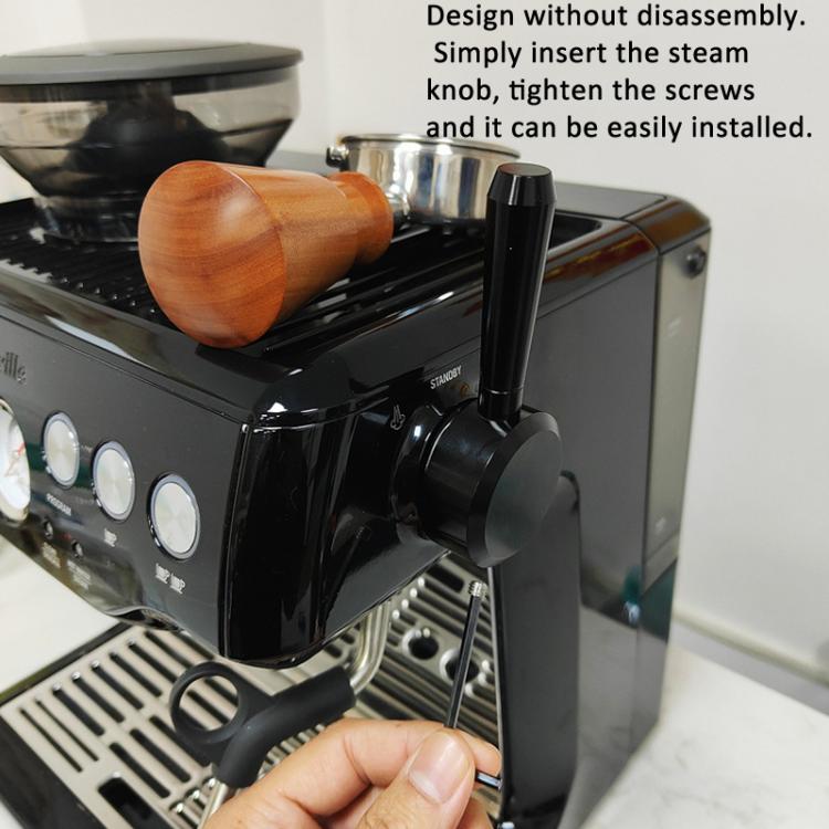 Black steam switch lever being installed on espresso machine with hand
