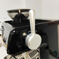 Silver external steam switch lever with round pull knob on espresso machine