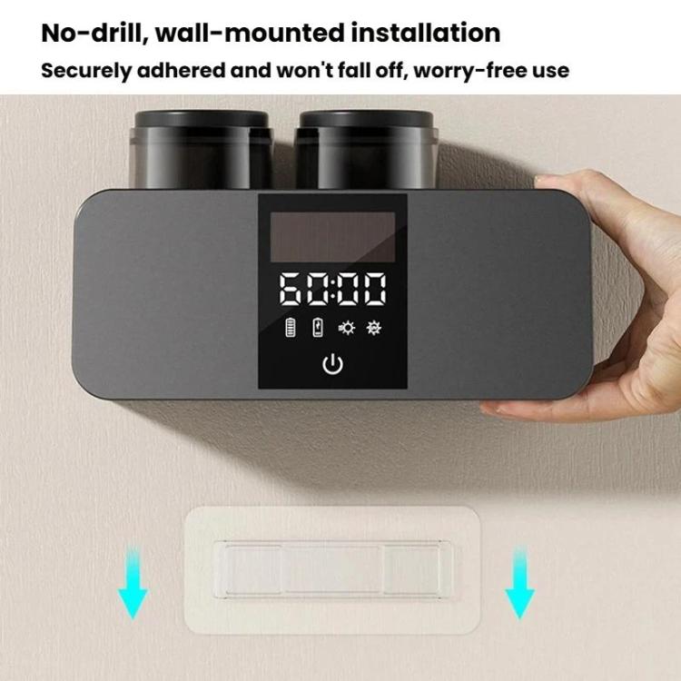 Black wall-mounted toothbrush holder with two cups, hand holding base and digital panel.