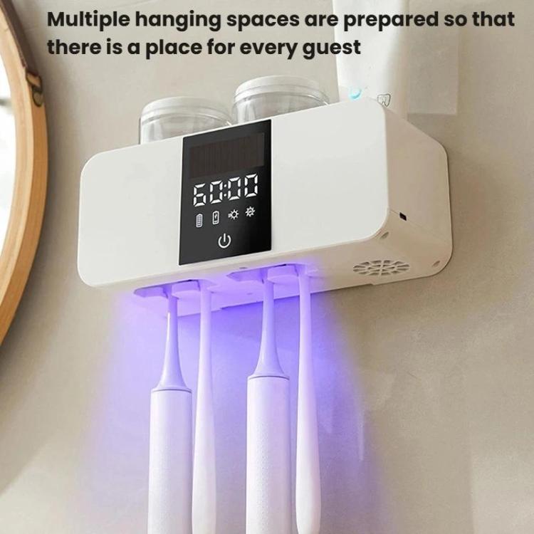 White wall-mounted toothbrush holder with cups and UV glow under the unit