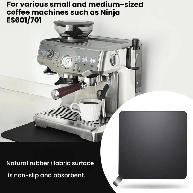 Coffee machine absorbent sliding pad on countertop, dark textured rubber-fabric surface