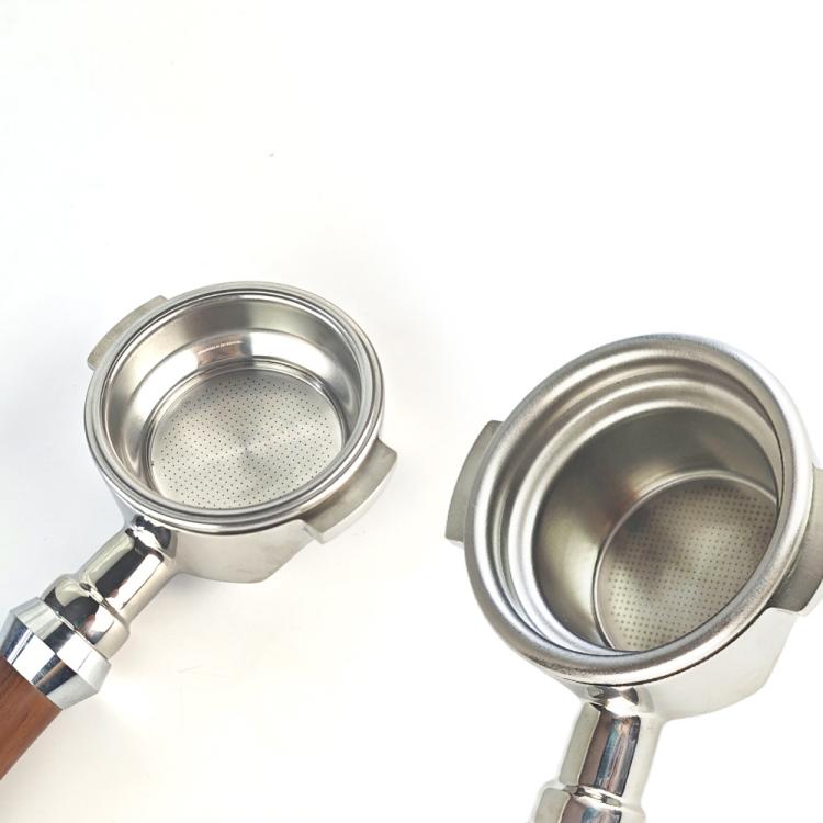 Two stainless steel portafilter baskets with perforated filter screens