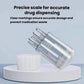 Clear dispensing bottle with prongs and white cap, shown on a small base