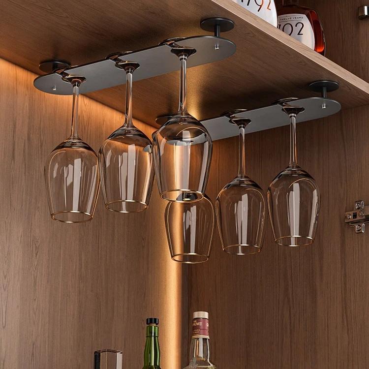 Under-cabinet wine glass holder with hanging clear glasses and metal ceiling mount