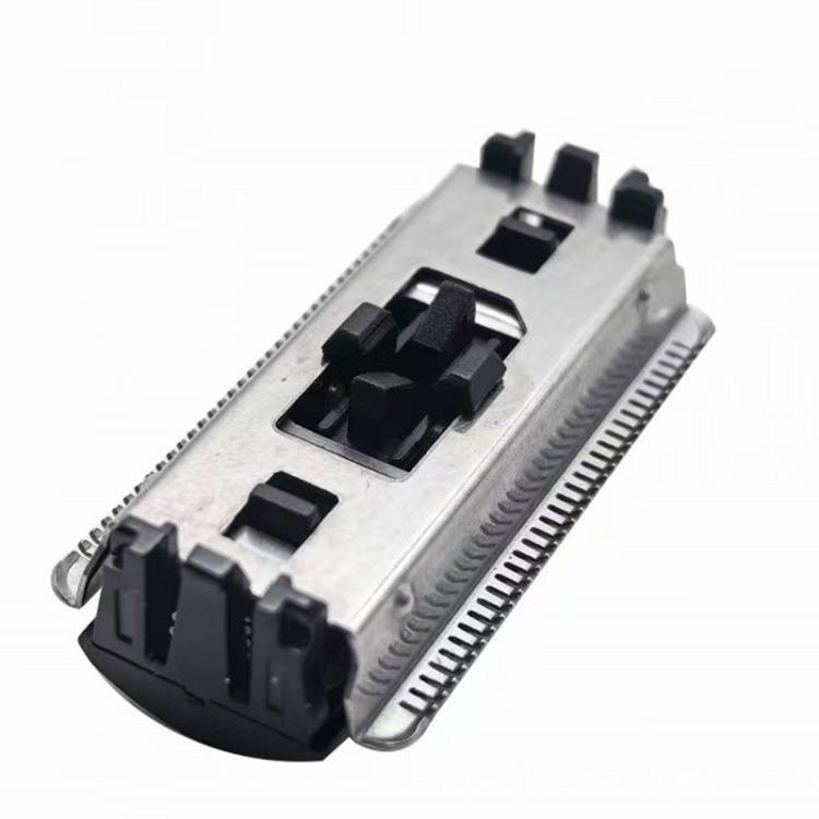 Replacement trimmer blade cartridge close-up with black mounting clips and metal teeth