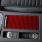 Storage compartment cover sticker panel, red textured strip with oval pull cutout
