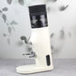 Coffee grinder with fitted black ribbed blowing hopper and clear outlet