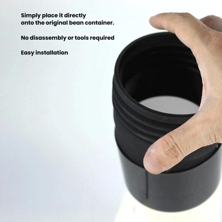 Hand inserting a black ribbed bean hopper onto a coffee grinder